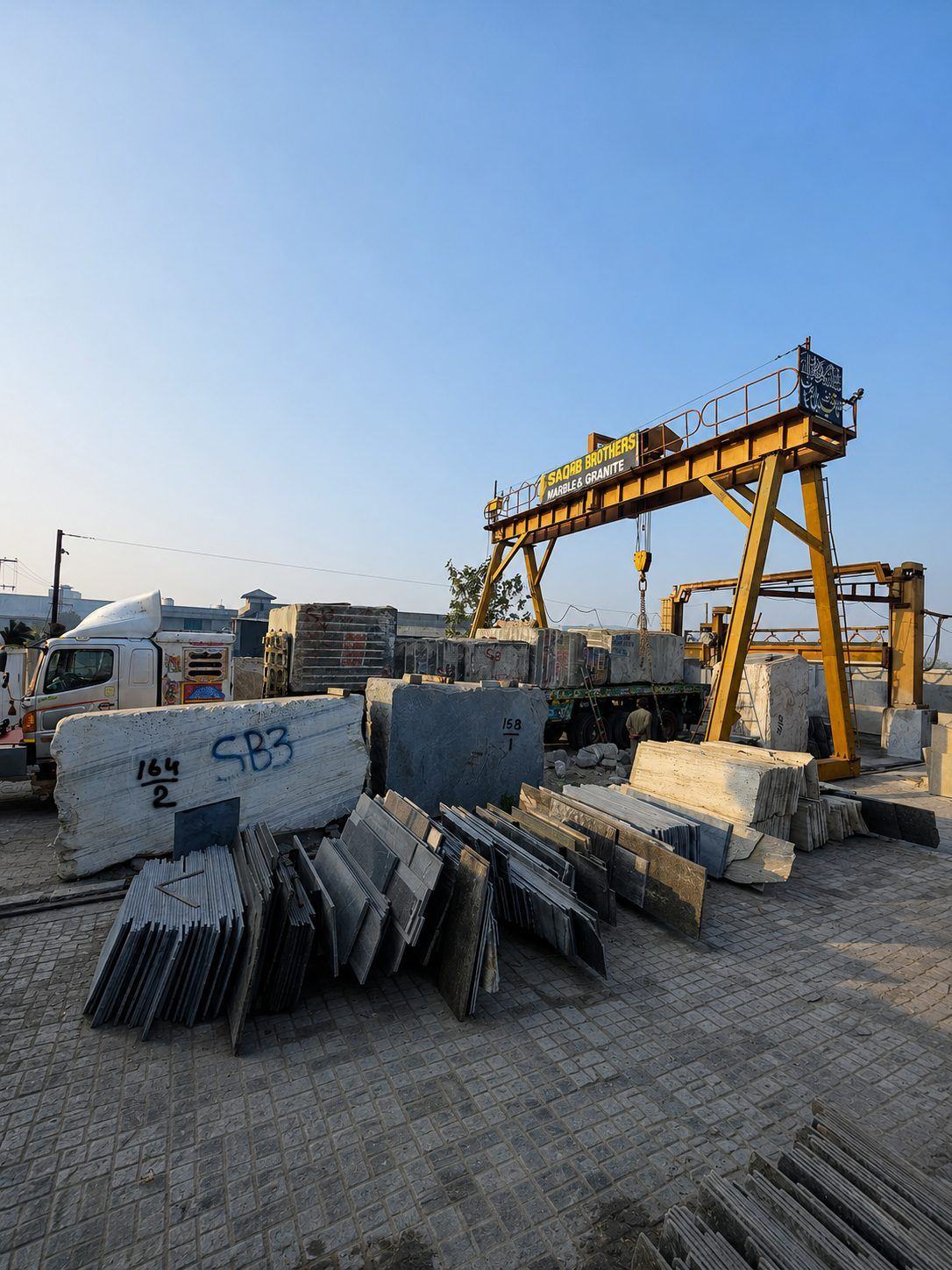 Container truck being loaded with dressed blocks